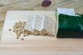 raw tempeh. soybeans and sliced Ã¢â¬â¹Ã¢â¬â¹raw tempeh on a wooden board